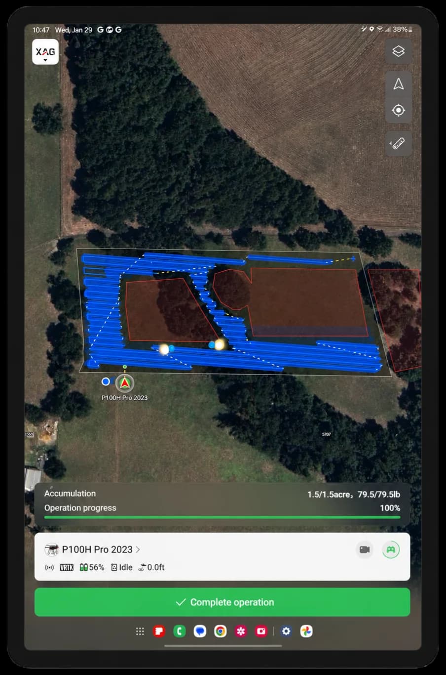 A tablet displaying the XAG flight-planning app after a completed spray job: blue serpentine flight passes covering a mapped block on satellite imagery, with Accumulation reading 1.5 of 1.5 acres treated and Operation progress at 100 percent